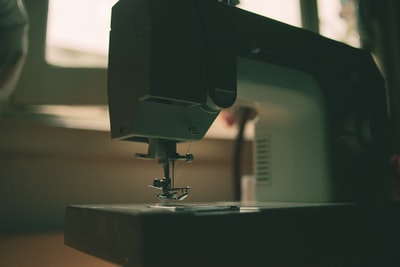 white sewing machine on table